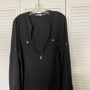 Calvin Klein sheer black top with gold hardware.